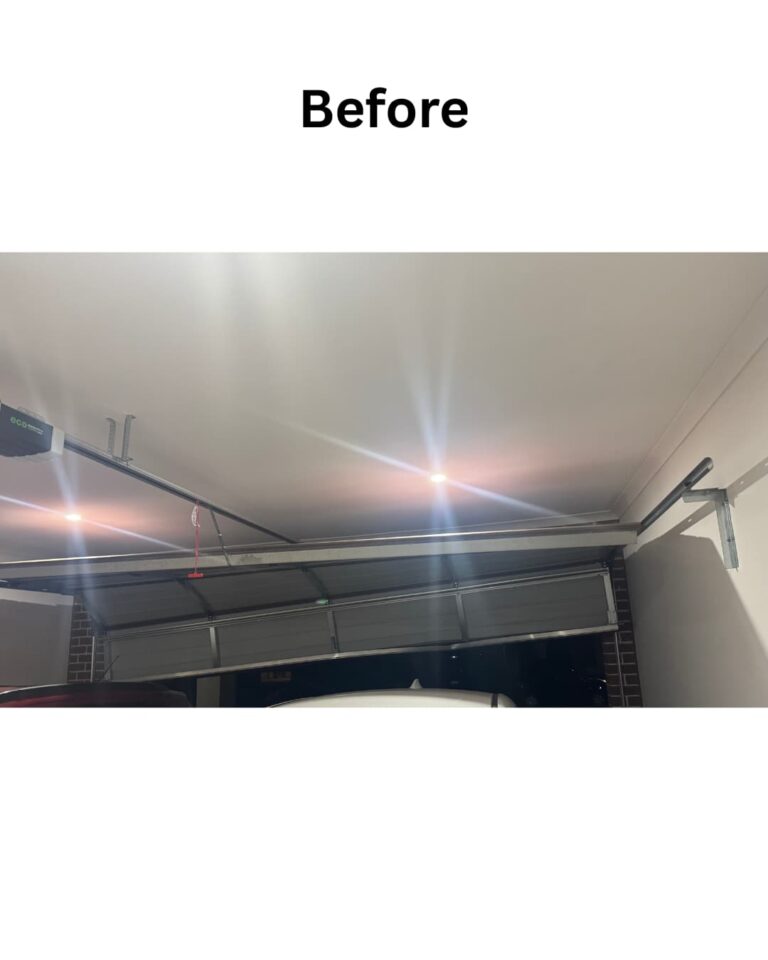 before image of Garage Door track misaligned due to car impact