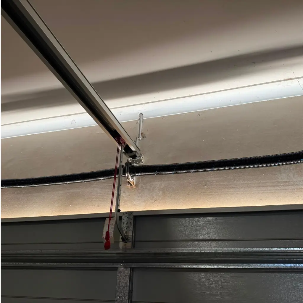 Image shows pair of torsion garage door springs