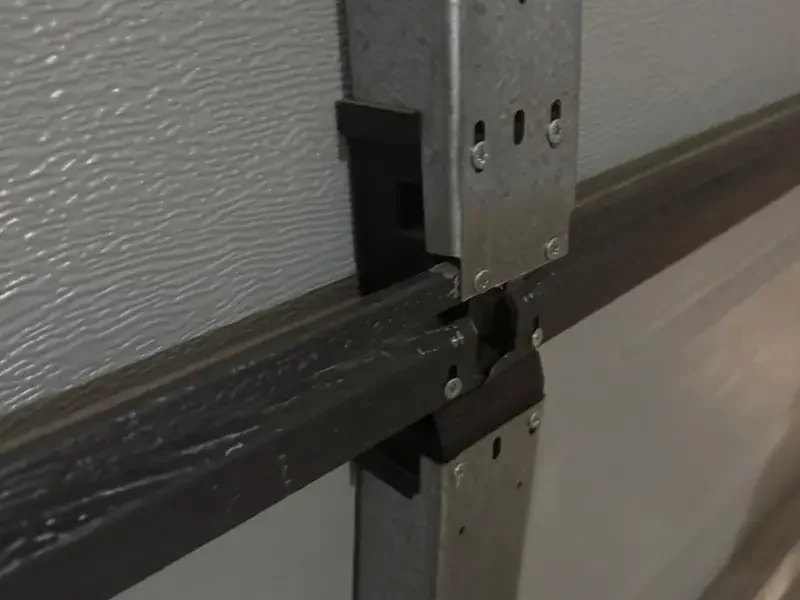 this is an image of centurion garage door broken hinge